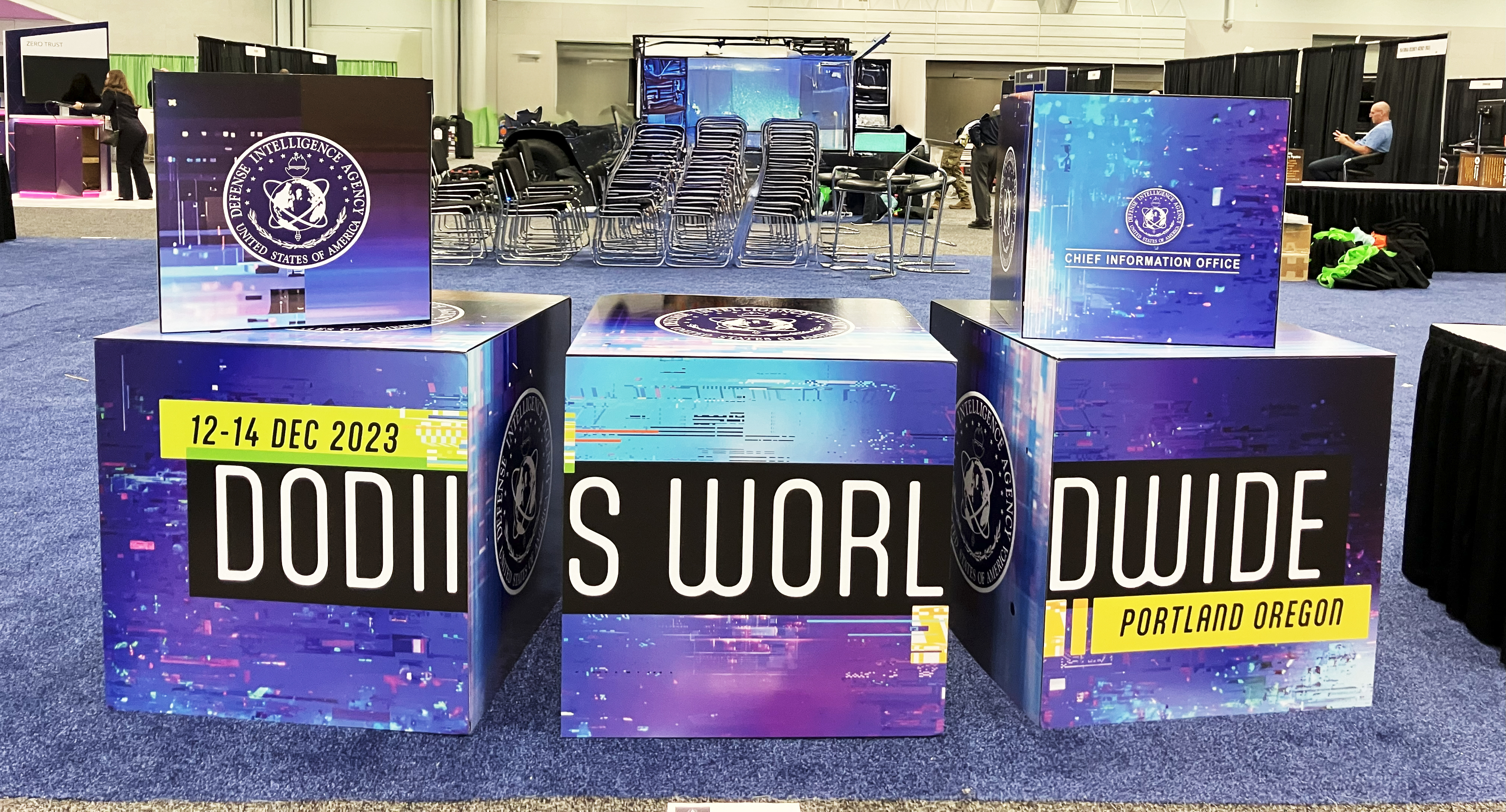 Cubes with DoDIIS branding on display in the DIA Booth